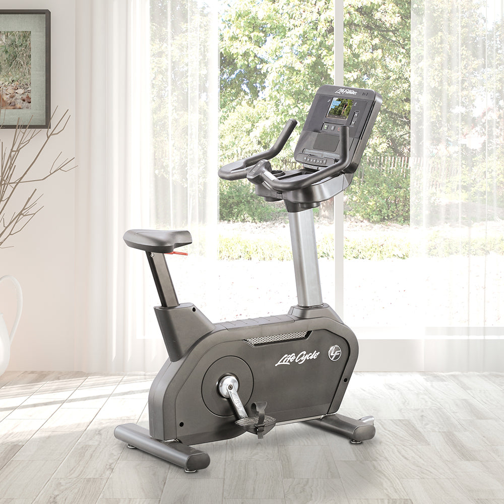 Club Series+ Upright Bike in home setting