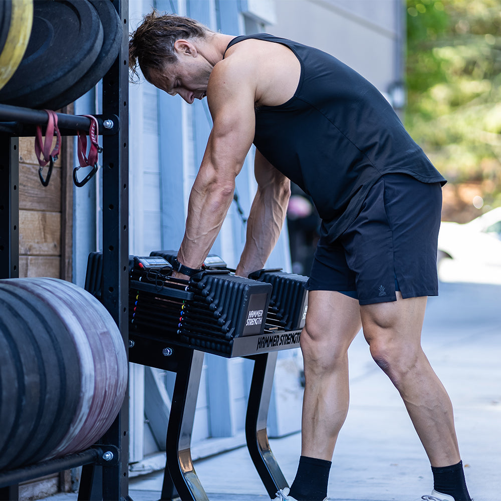 Marcus Filly grabbing PRO 100s from Hammer Strength PowerBlock Stand