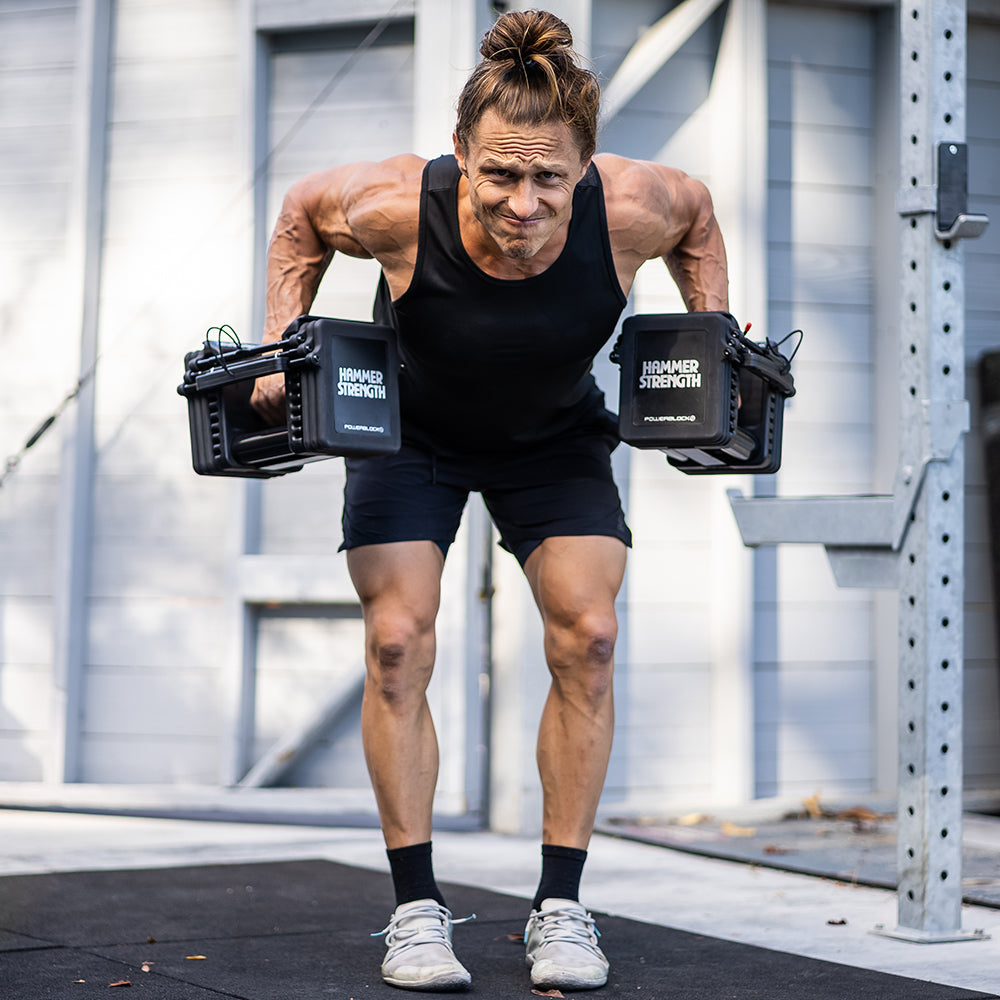 Marcus Filly rowing with PRO 100 Adjustable Dumbbells