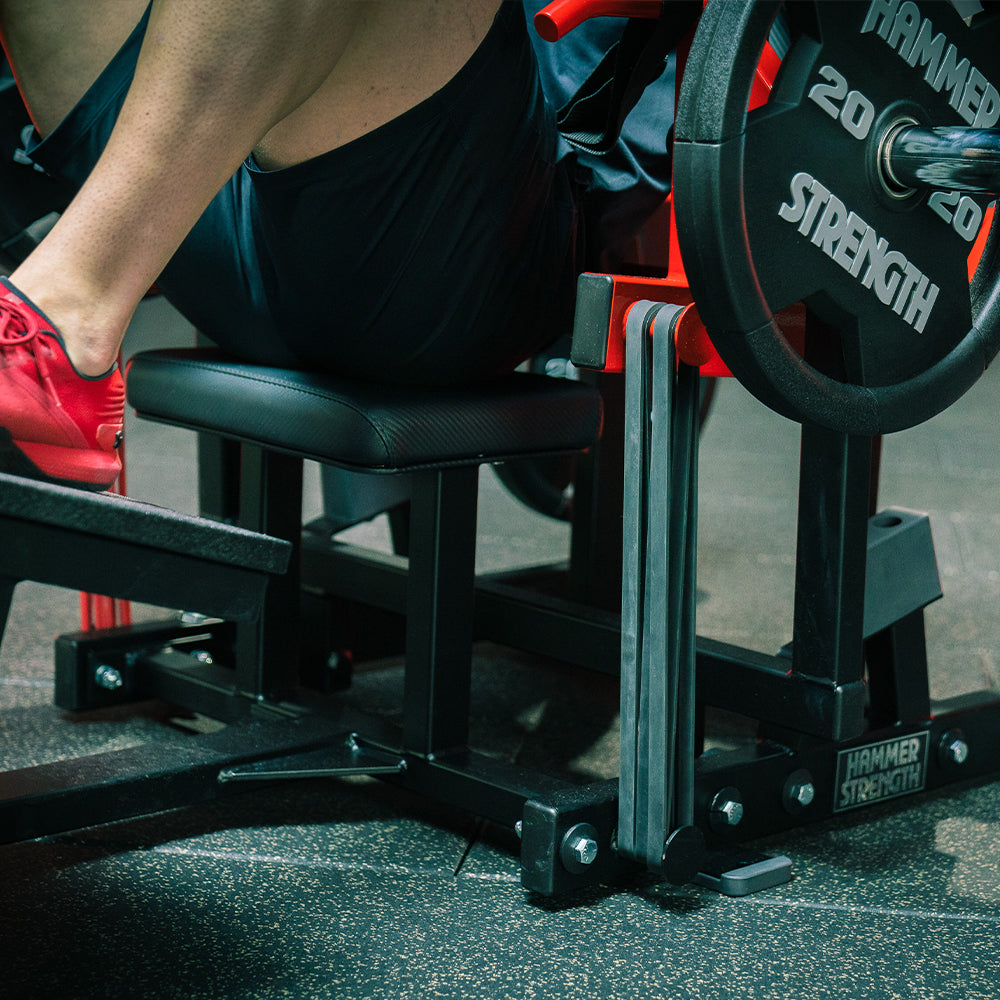 Glute bridge on machine with black mini bands